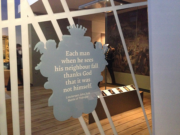 Quote within a cartouche printed onto a mirror