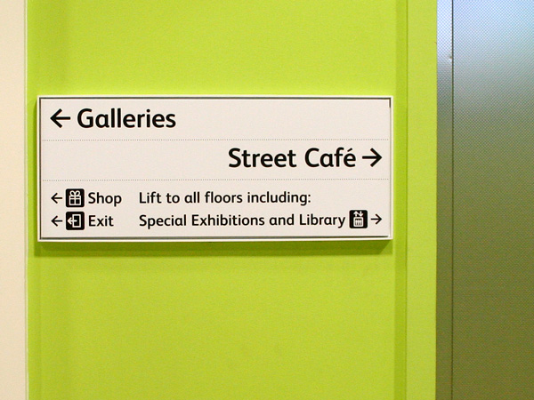 Interior sign in gallery entrance threshold